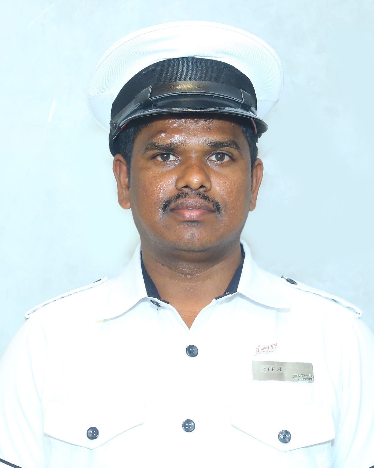A close up shot of a staff member of Great Trails Yercaucd by GRT hotels.
