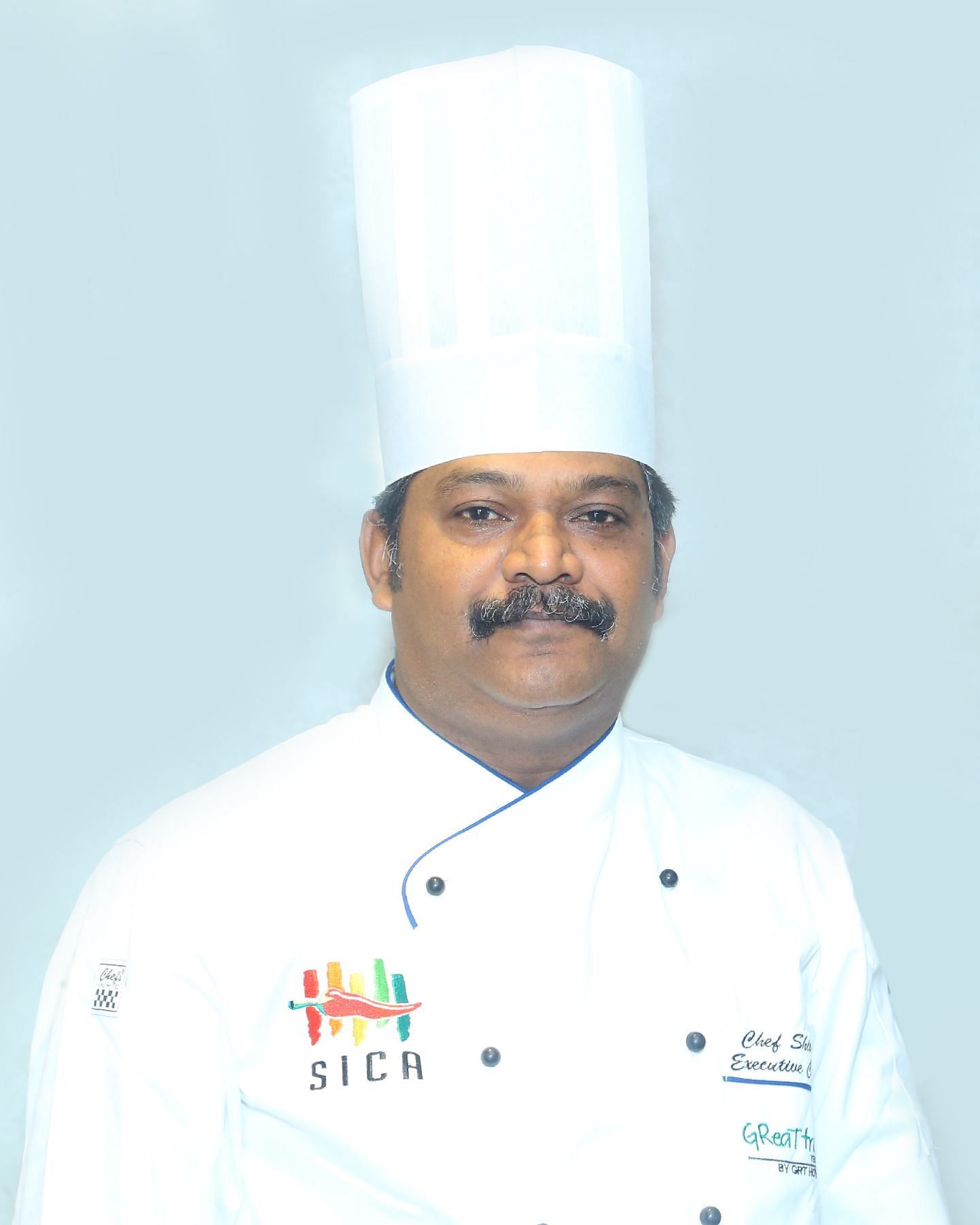 A close up shot of a staff member of Great Trails Yercaucd by GRT hotels.