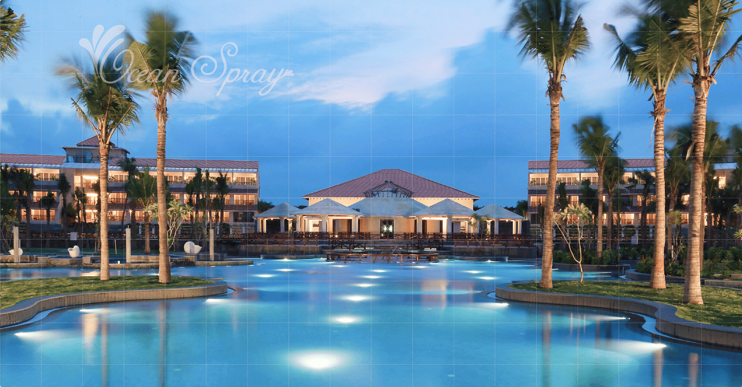 swimming pool surrounded by villa and tree at Ocean Spray, Puducherry.