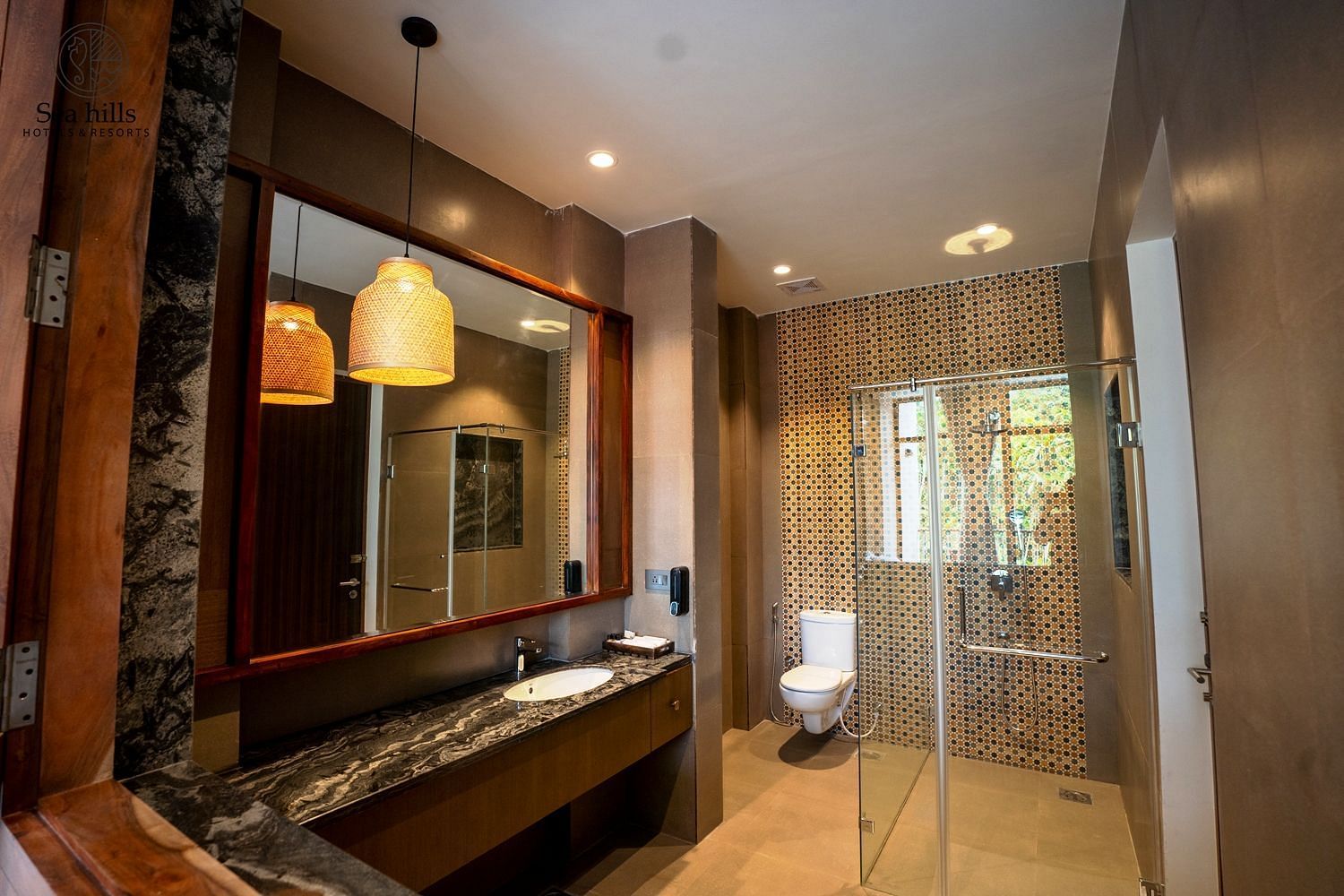 Bathroom featuring a large mirror, stylish lighting, and modern fixtures, offering a luxurious shower experience - Sea Hills Resort, Swaraj Dweep (Havelock)