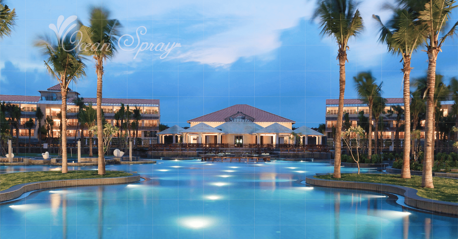 swimming pool surrounded by villa and tree at Ocean Spray, Puducherry.