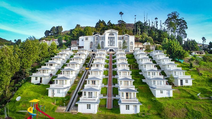 Exterior of a hotel on a hillside during the day