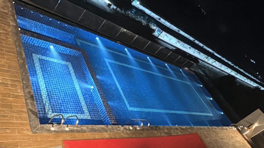The rooftop swimming pool at Le ROI Digha Hotel, West Bengal, featuring a separate shallow section and a deck area.