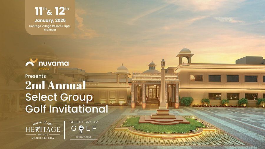 Eye-level view of the traditional architecture of Heritage Village, likely in Rajasthan, hosting the 2nd Annual Select Group Golf Invitational. Sunny day with courtyard and gardens
