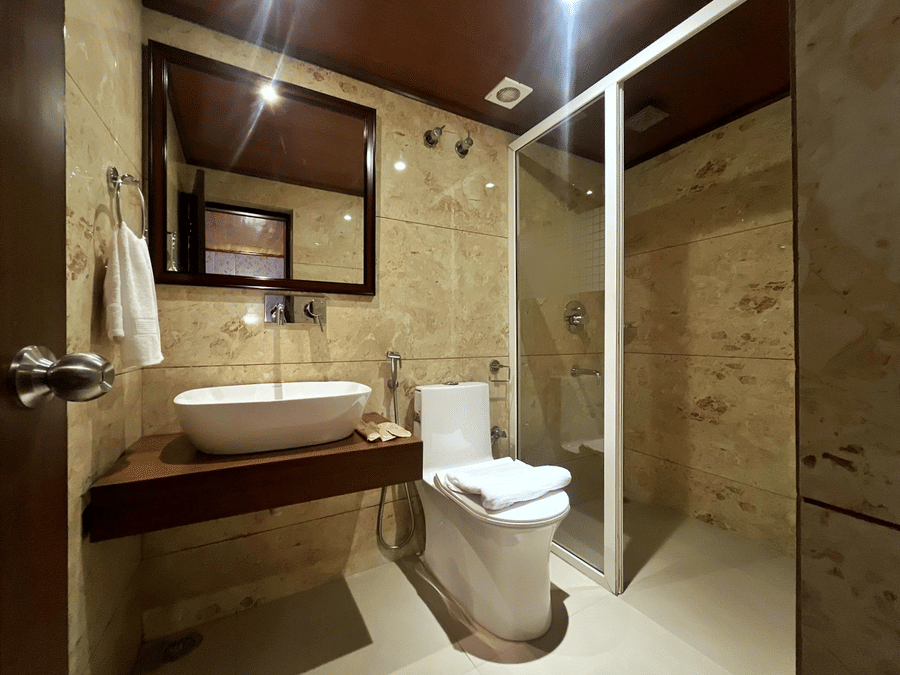 Modern bathroom with sleek fittings and spacious layout at Mount Thistle Boutique Hotel, Darjeeling.