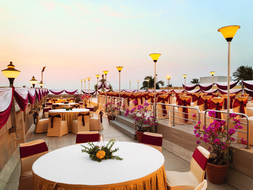Overview of the seating arrangement on the Rooftop banquet Hall at Hotel Ramada Plaza Palm Grove.