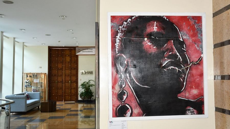 Lobby wall art featuring stylized portrait hanging above seating at The Boma Nairobi.