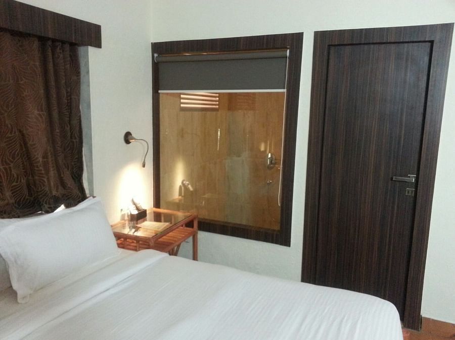 Adamo Resort Matheran - A close up view of bed offered in bungalow Bedroom