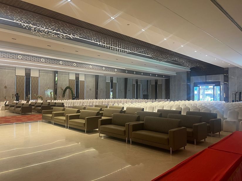 A spacious banquet hall featuring comfortable seating arrangements for gatherings.