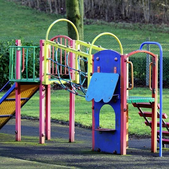A colorful children playing equipment on a park
