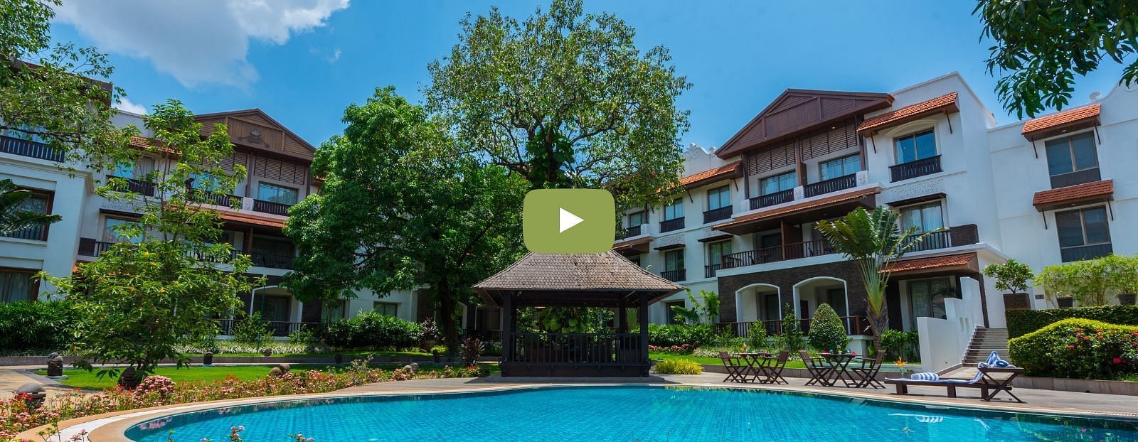 A screenshot from a Youtube video features the hotel facade - Rhythm Lonavala