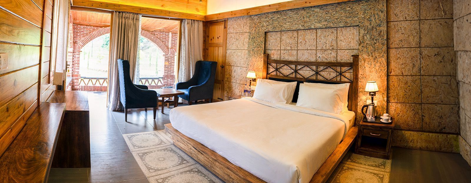 A view of a large bed in a room at The Sylvan Retreat, Dehradun.