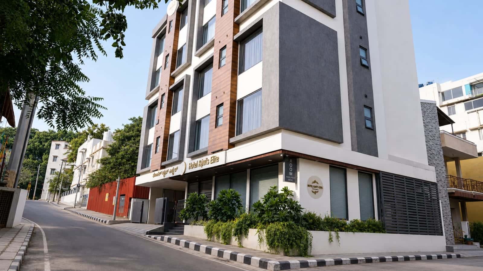 Hotel Ritvi's Elite on the corner of 1st Cross Road, Mission Road, with the entrance and signage in view