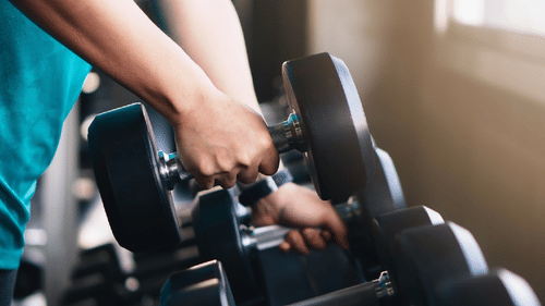 Image of a hand lifting a dumbbell