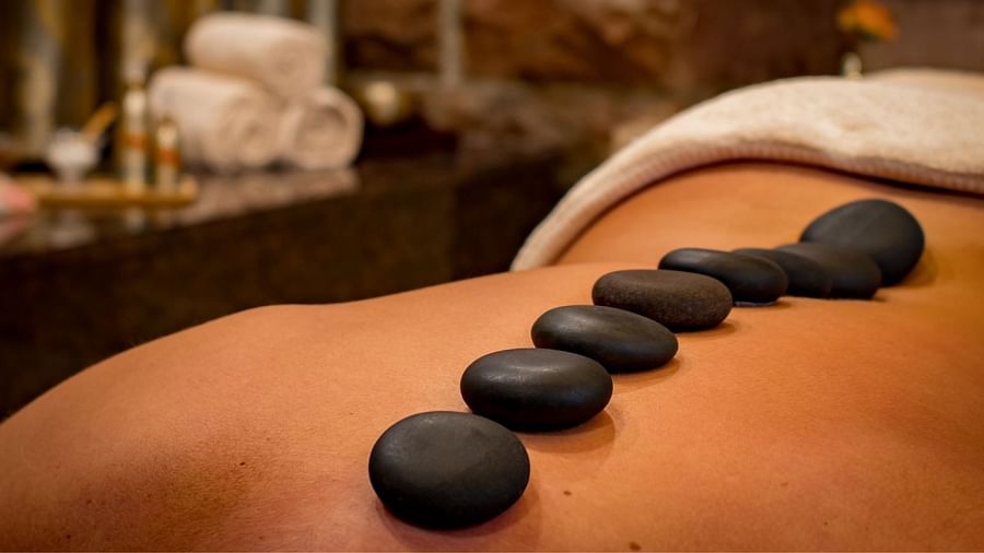 Spa therapy with stones on the back of a guest at The Boma Nairobi.