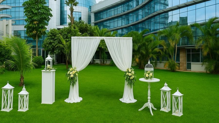 Outdoor event decorations with flowers, tables and white curtains at The Boma Nairobi.