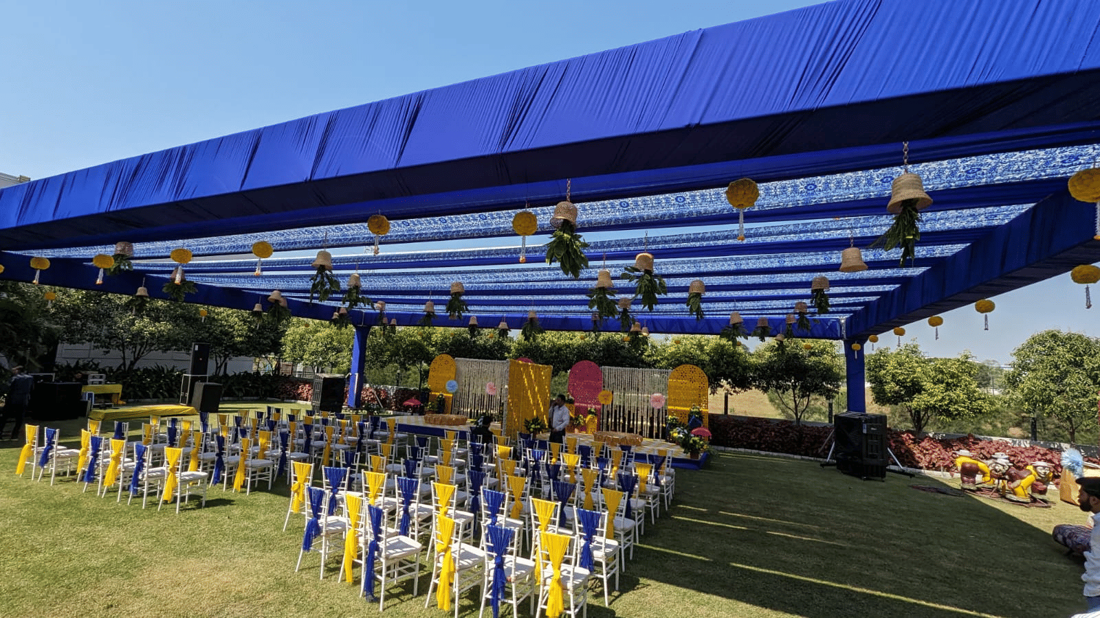 Elegant outdoor event setup at Gulmohar Garden, Papaya Tree Hotels, featuring a beautifully designed canopy and neatly arranged seating for guests.