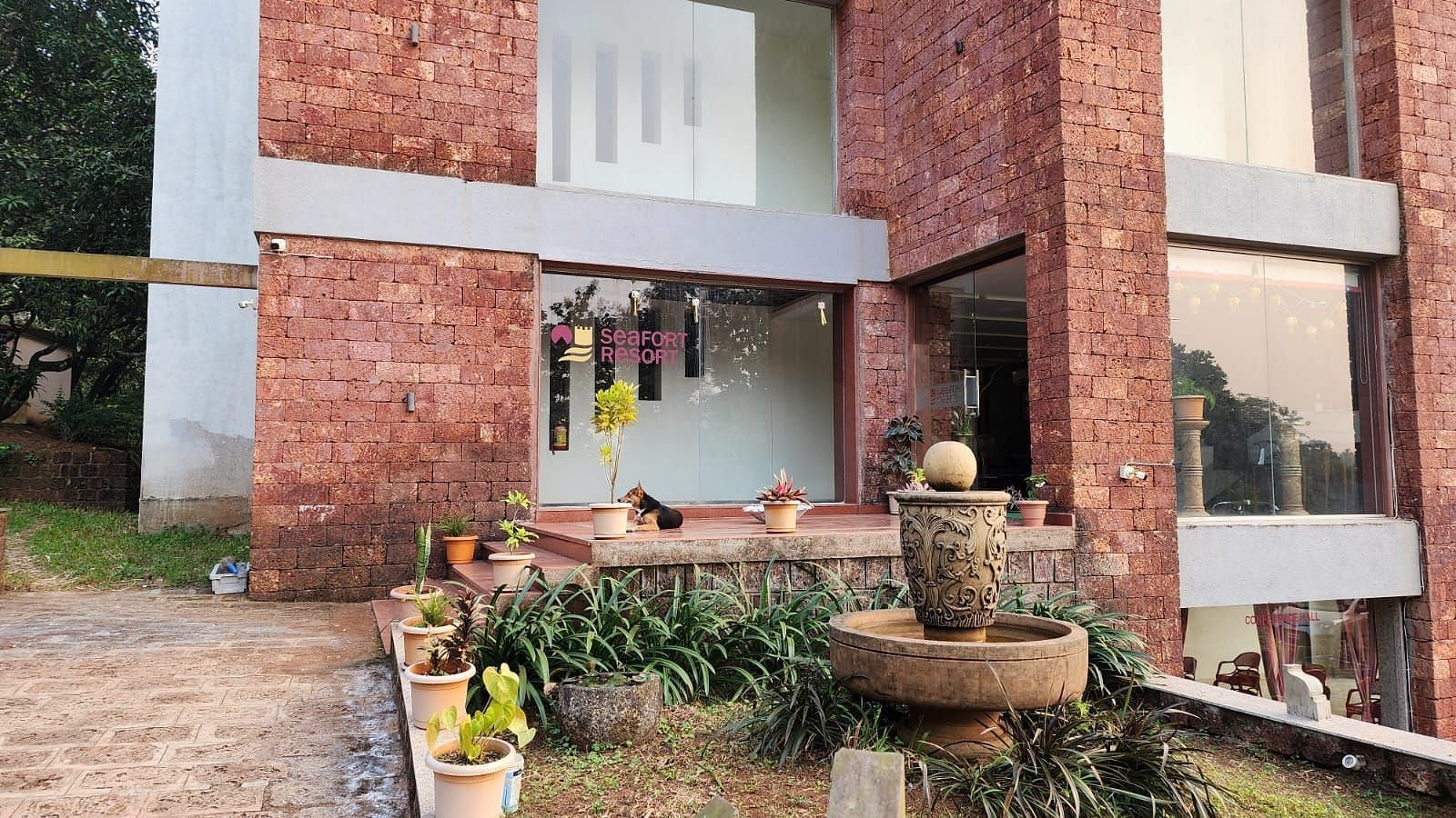 The entrance of the resort with antique pots placed on the side as decoration at SeaFort Beach Resort