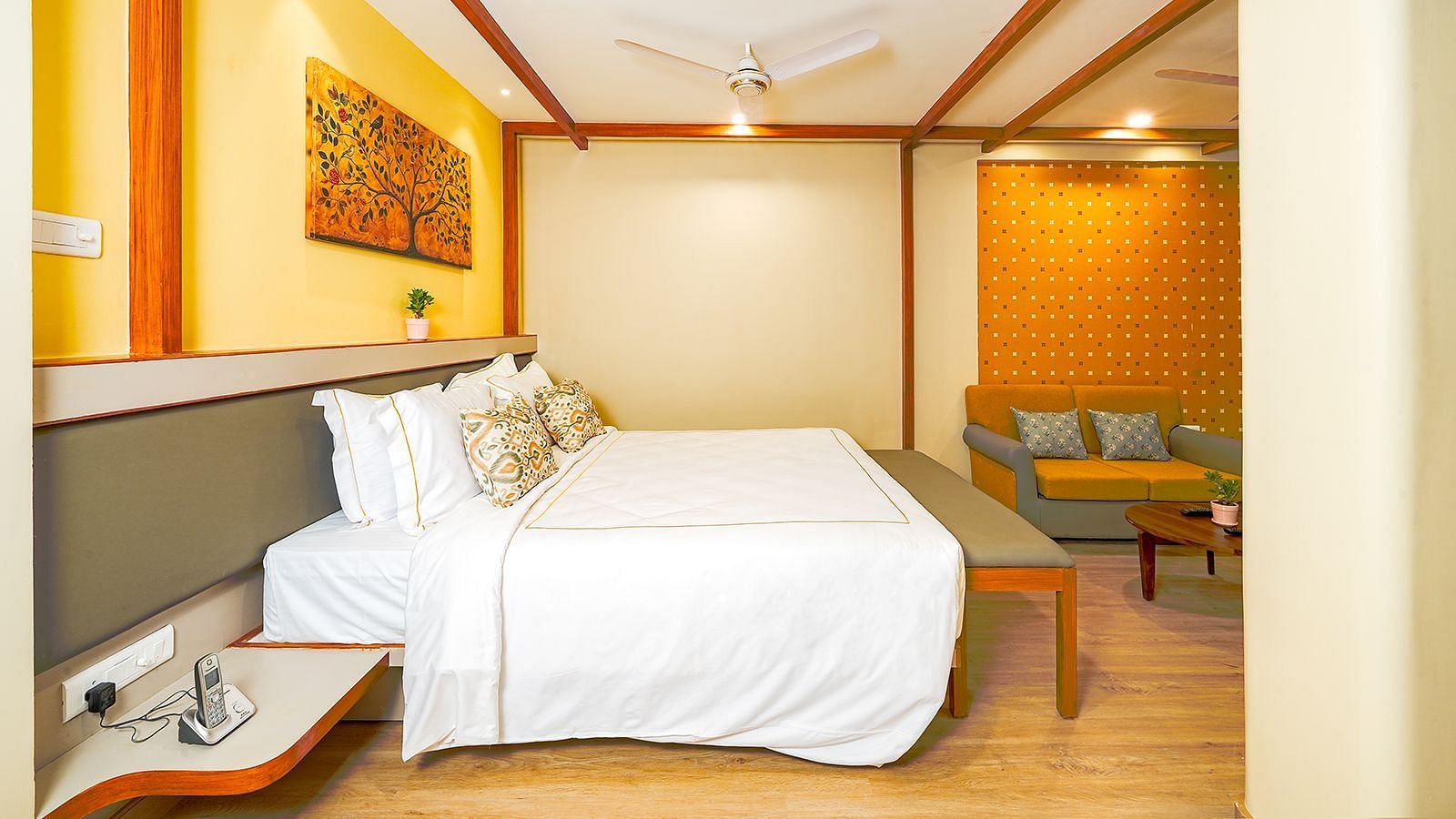 Cozy bedroom with contemporary design and soft lighting at Vasundhara Villa, perfect for a comfortable stay.