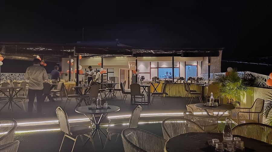 outdoor event space with a huge table and chairs at Hotel Eastern Gate, Port Blair