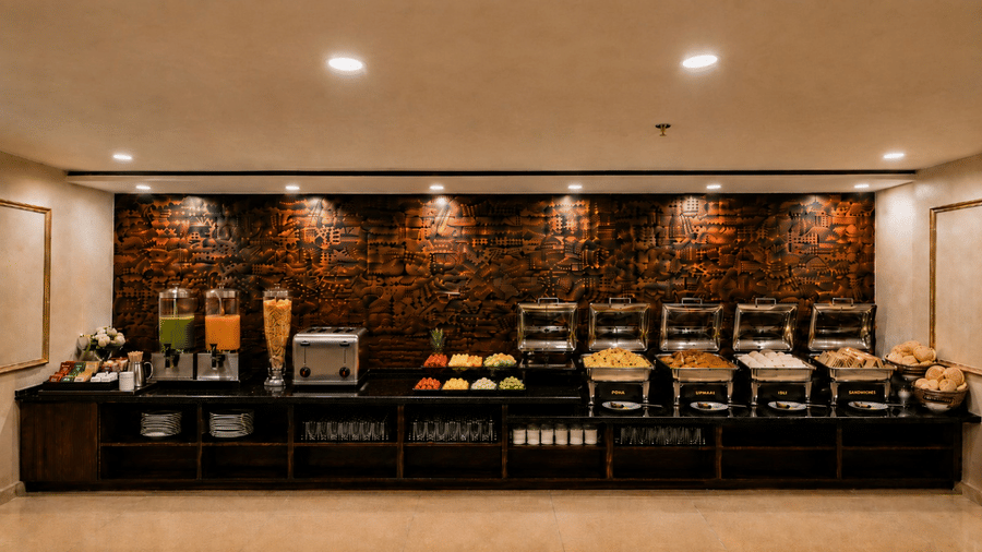 A wide view of the complete long buffet counter line arranged inside the dining area at Lime Tree Hotel & Banquet, Jaipur.