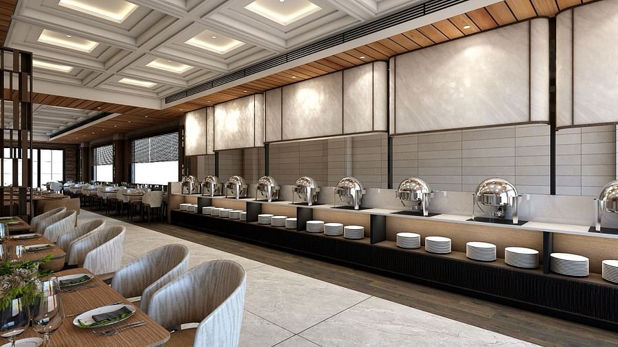 The buffet counter with various porcelain plates lined up together right behind the dining area of the restaurant - Namaste Corbett