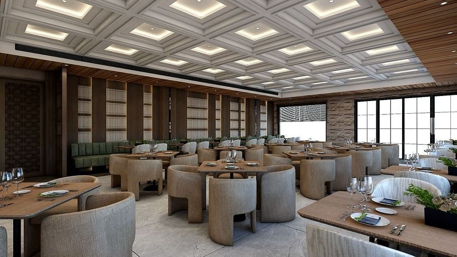 Corner view image of the restaurant with well arranged seating area and a false ceiling above it - Namaste Corbett