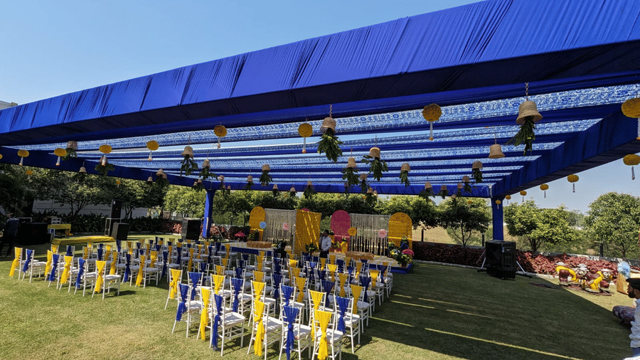 Elegant outdoor event setup at Gulmohar Garden, Papaya Tree Hotels, featuring a beautifully designed canopy and neatly arranged seating for guests.