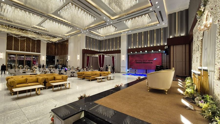 Grand event space with a stage setup and ambient lighting, ideal for weddings or conferences at Ramada by Wyndham Sonipat Murthal