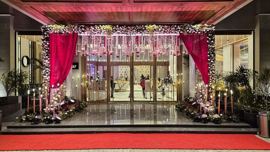 Lavishly decorated entrance with floral arrangements and red carpet for special occasions at Ramada by Wyndham Sonipat Murthal