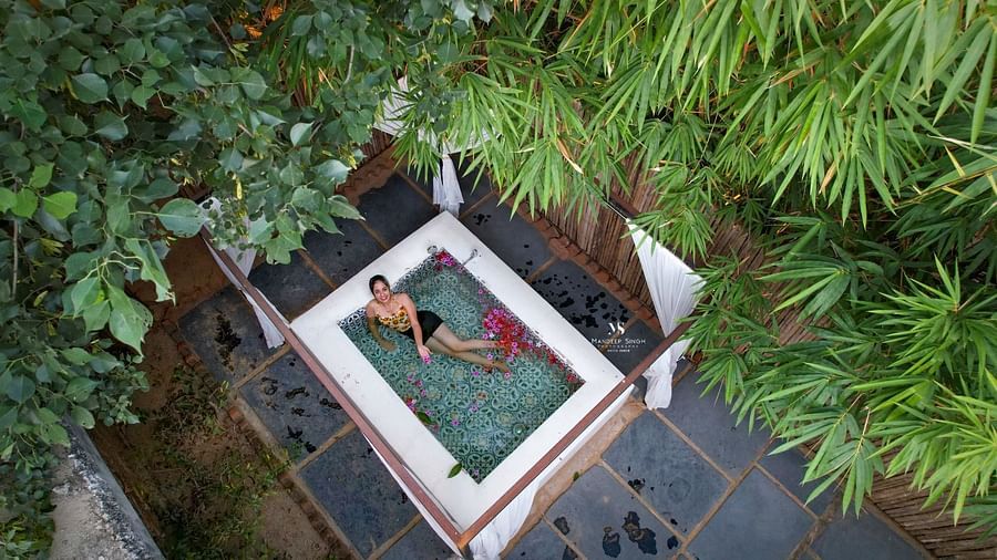 Aerial view of a swimming pool with a person inside it at Valley by Grassfield.