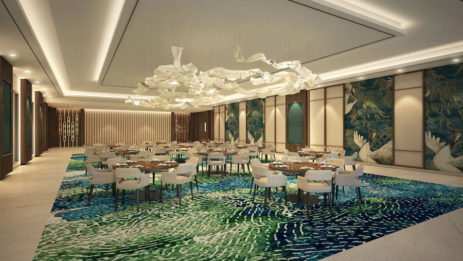 Skywings Sarovar Portico Mathura restaurant 3D render with decorative mosaic feature wall, round dining tables, chandelier, and bright recessed lighting.