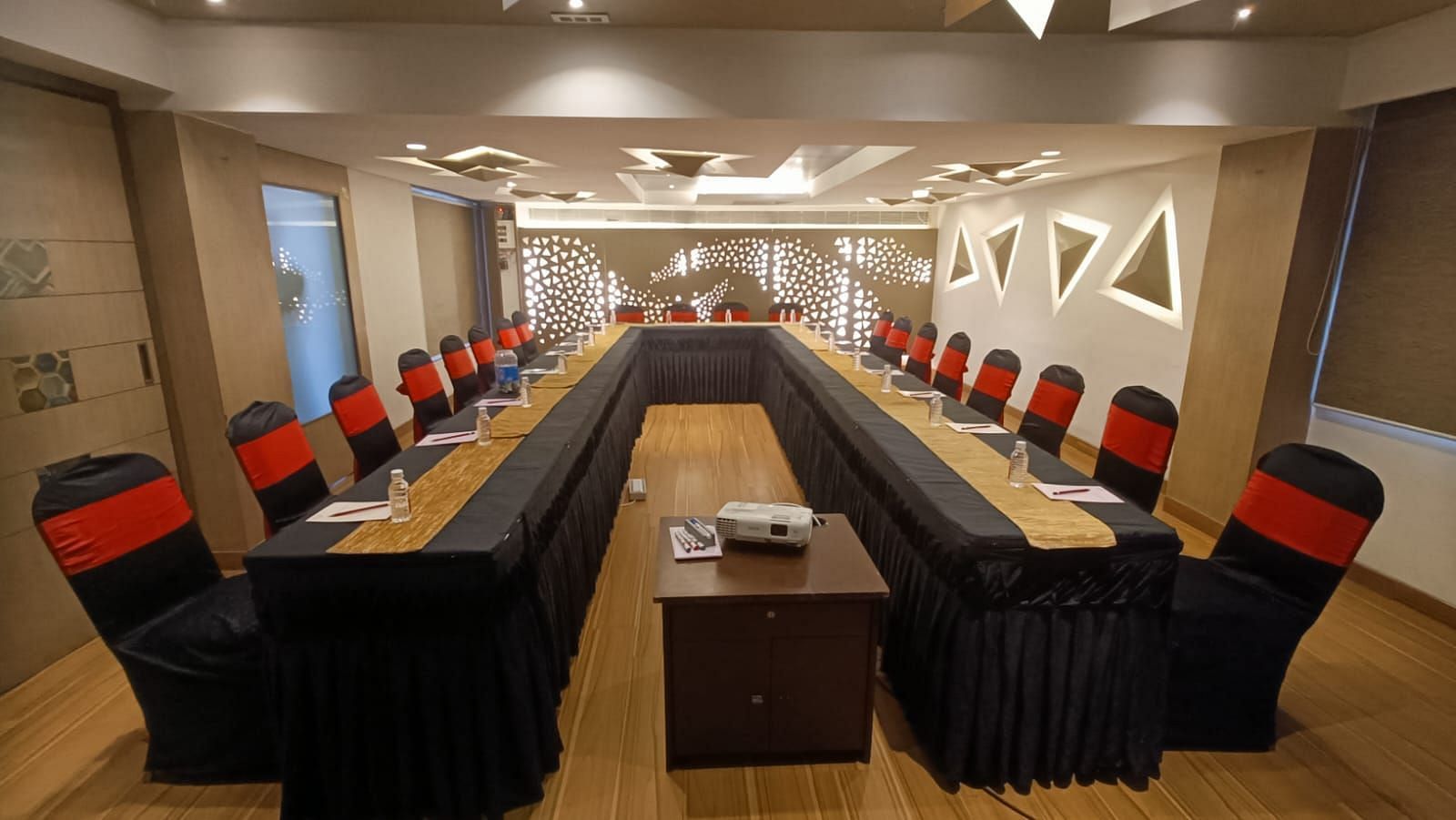 Image of a boardroom with tables and chairs at The Oriental Residency