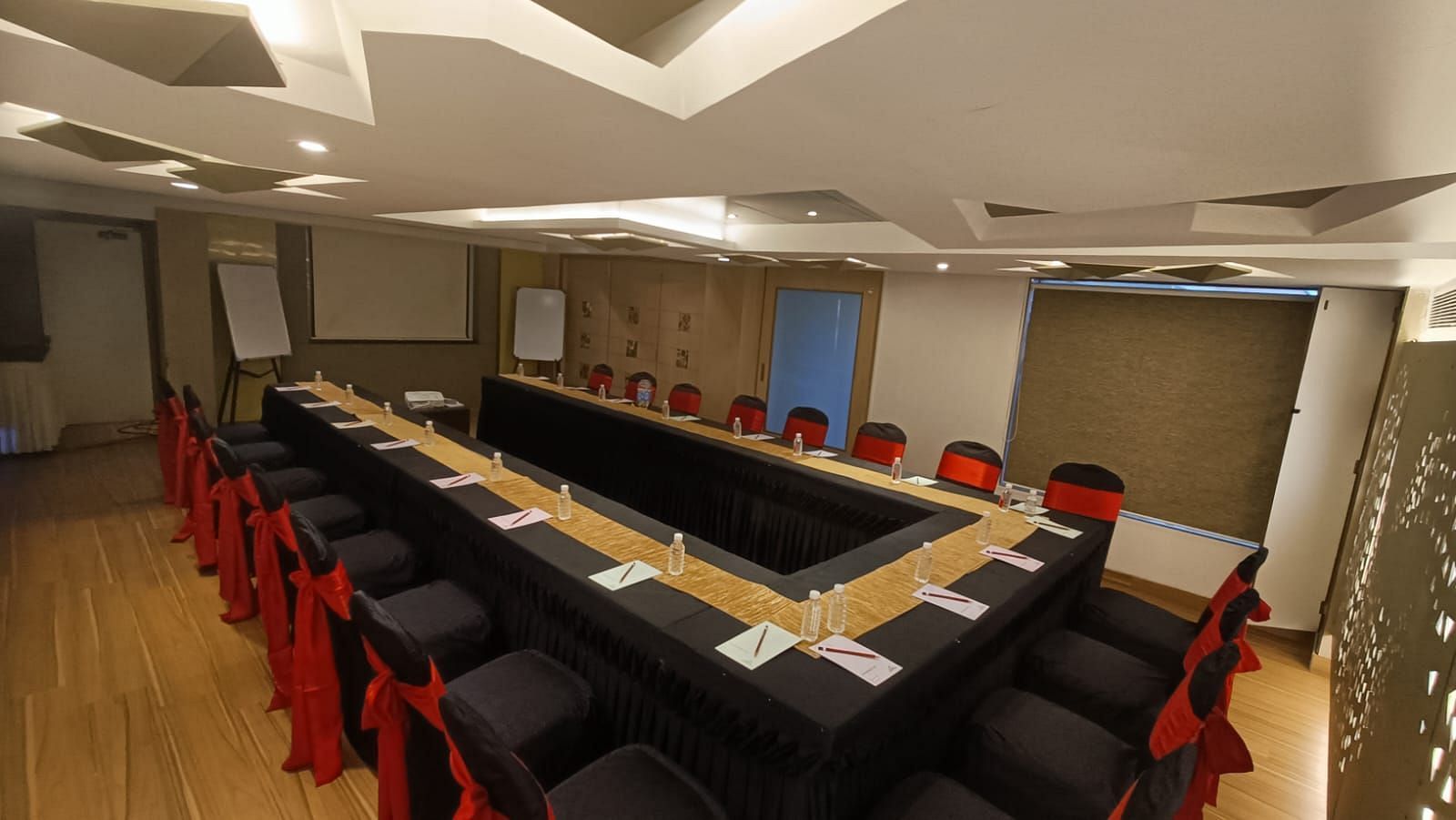 Side veiw of a boardroom with tables and chairs at The Oriental Residency