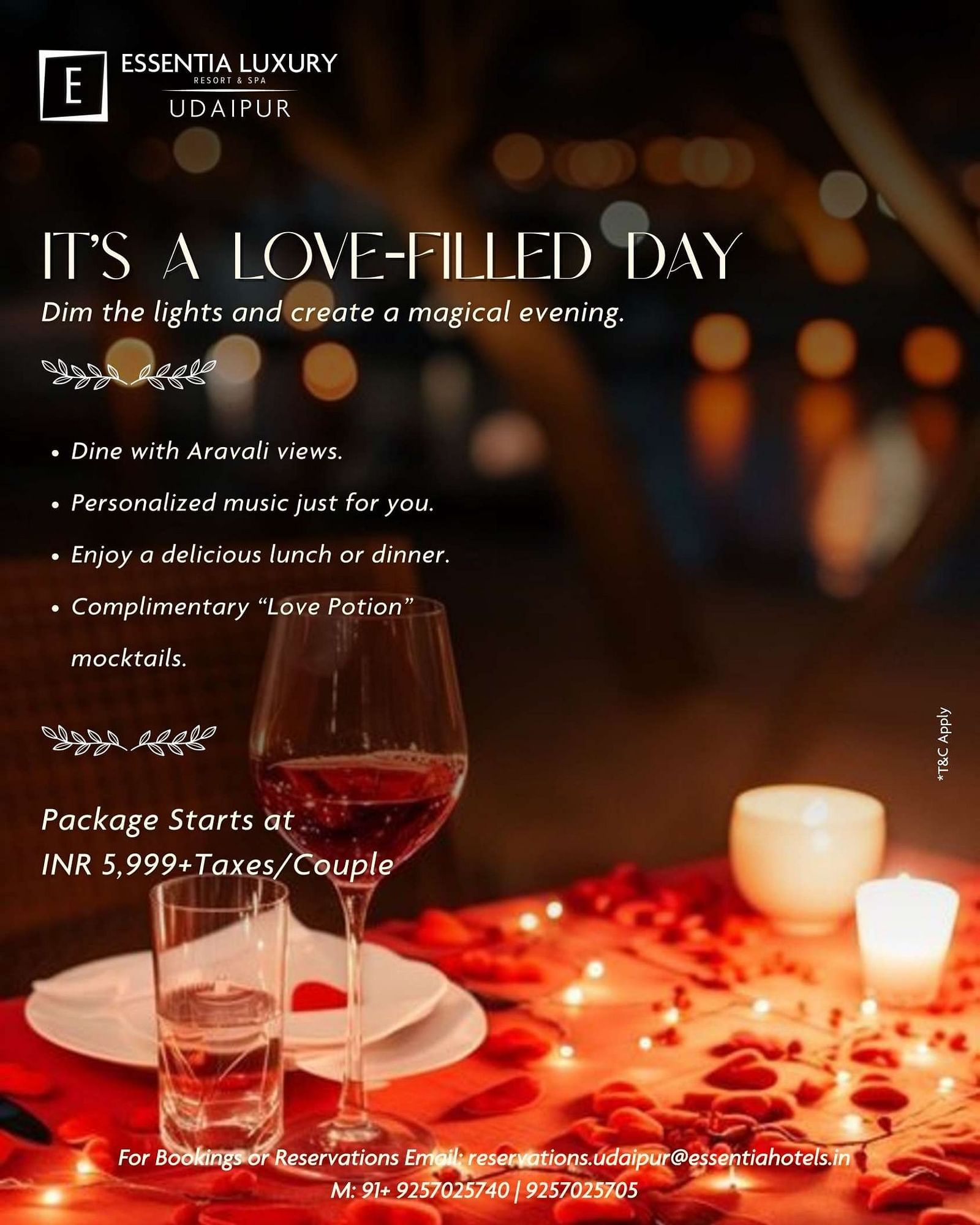 Romantic table setup with wine glasses, candles, and rose petals. Offer text promotes a couple’s dining experience at Essentia Luxury Resort & Spa, Udaipur with Aravali views, music, meals, mocktails, priced at INR 5,999+ taxes per couple.