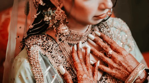 A woman in traditional jewelry and clothing.