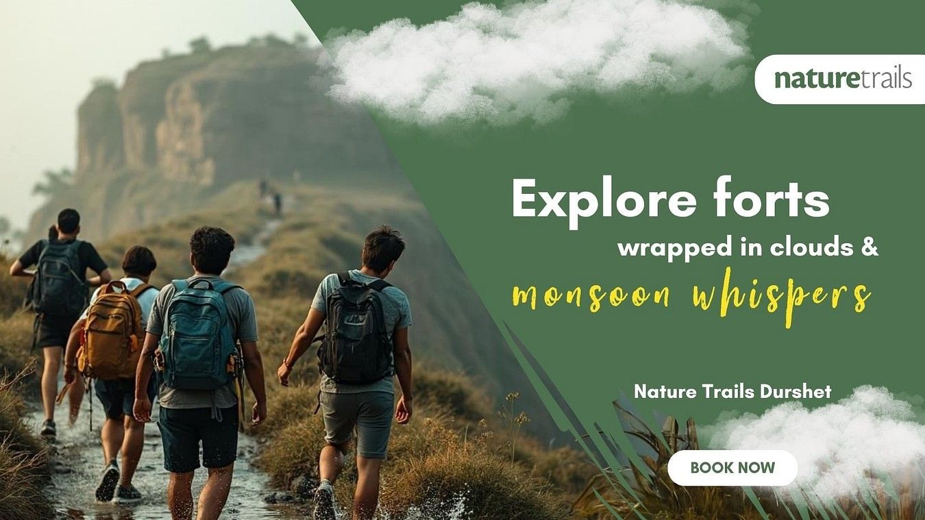  Group trekking towards ancient forts surrounded by clouds at Nature Trails, perfect for monsoon explorers and adventure lovers.