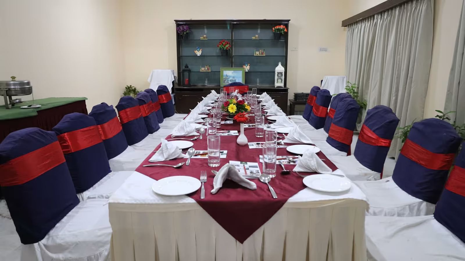 Banquet hall elegantly arranged with tables and chairs, ready for a festive celebration.