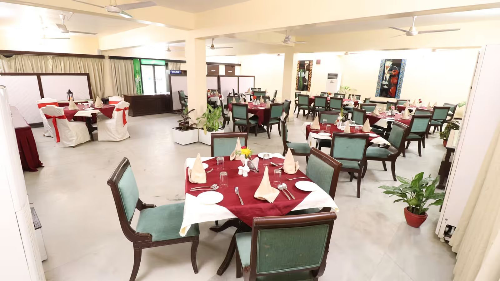 Light House Restaurant dining area set with tables, chairs, and cutlery, all prepared for a delightful meal.