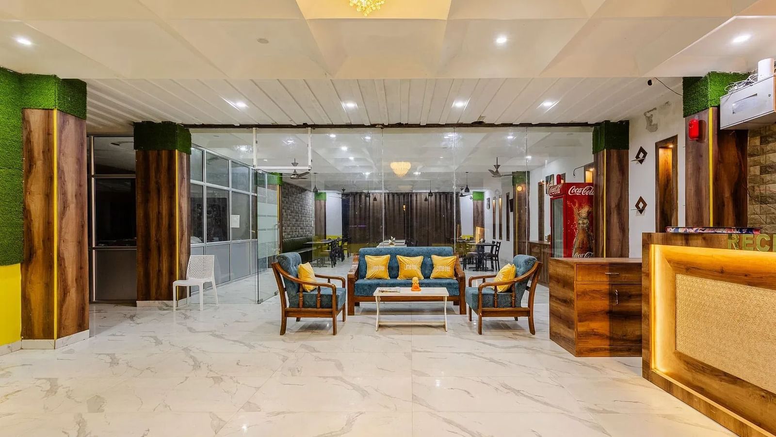 A spacious hotel lobby with a reception desk and multiple seating arrangements - Lime Tree Hotels & Banquet, Vrindavan