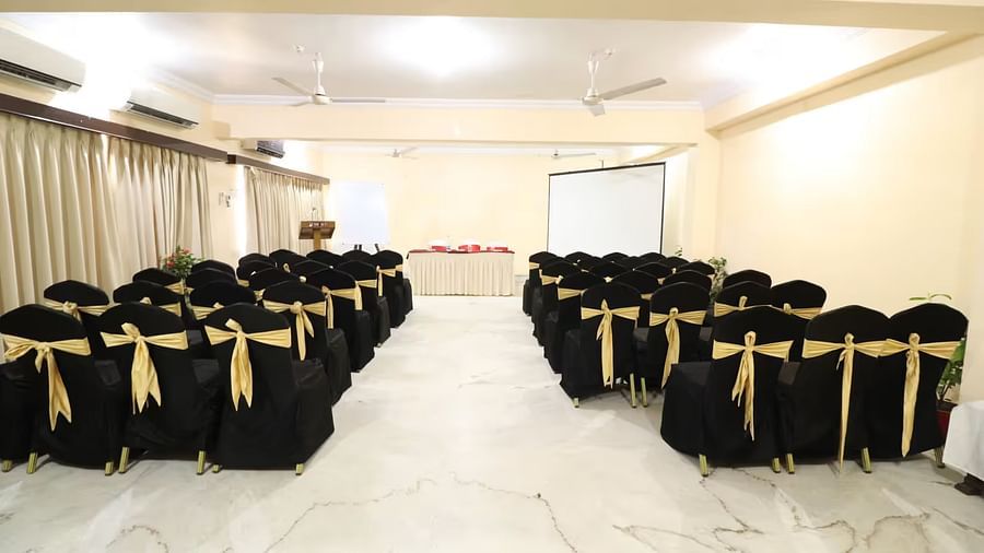 Pelican Event Hall, viewed from the back, features a large conference table at the front, with seating sections arranged on both the left and right sides.