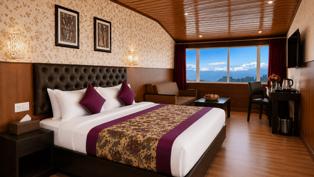 Premium Room at Valmere Thistle Boutique Hotel, Darjeeling with a king bed, wall-mounted TV, a desk with a kettle, and snow-capped mountain views.