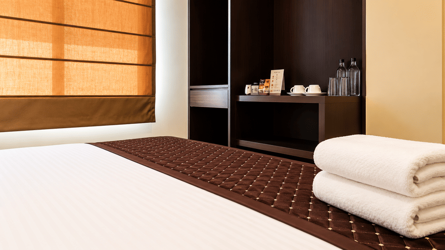 Queen bed in Deluxe Non AC Room at Mount Embassy Hotel