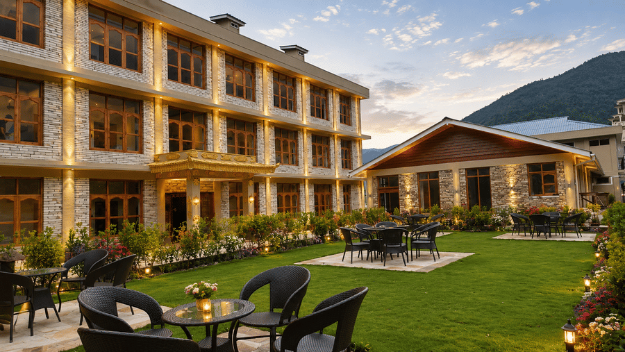 Outdoor seating area on a landscaped garden lawn at Summit Rungkhung Village Resort - The Signature Collection.