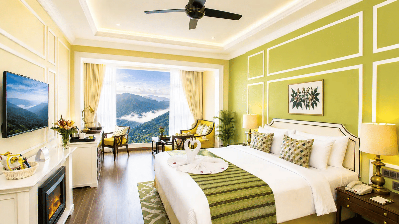 Tropic Green Room at Fragrant Nature Munnar with king bed, green accent wall, fireplace, and panoramic mountain view