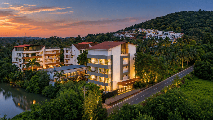 A scenic aerial view of the cosy BluSalzz Collection - Casa Onze, Arpora nestled in greenery.