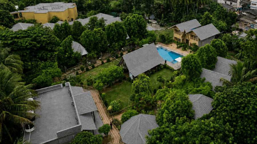 Several buildings with plants and trees | Pipul Odi Art Museum Resort, Chilika