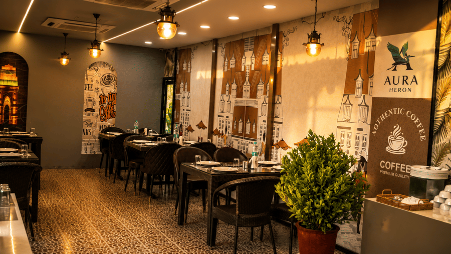 The Pamposh, New Delhi | A rooftop resturant with chairs and tables set for dining.