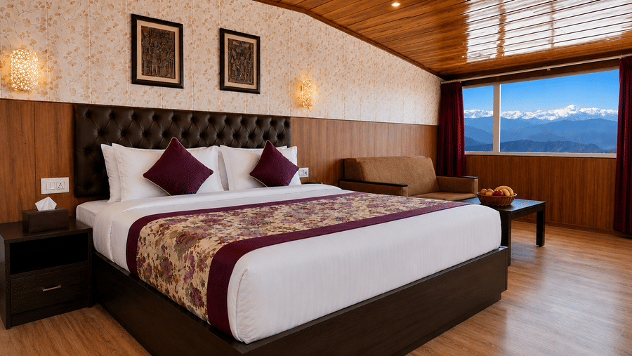 Premium Room at Valmere Thistle Boutique Hotel, Darjeeling with a king bed, sofa, and a large window showing snow-capped Himalayan peaks.