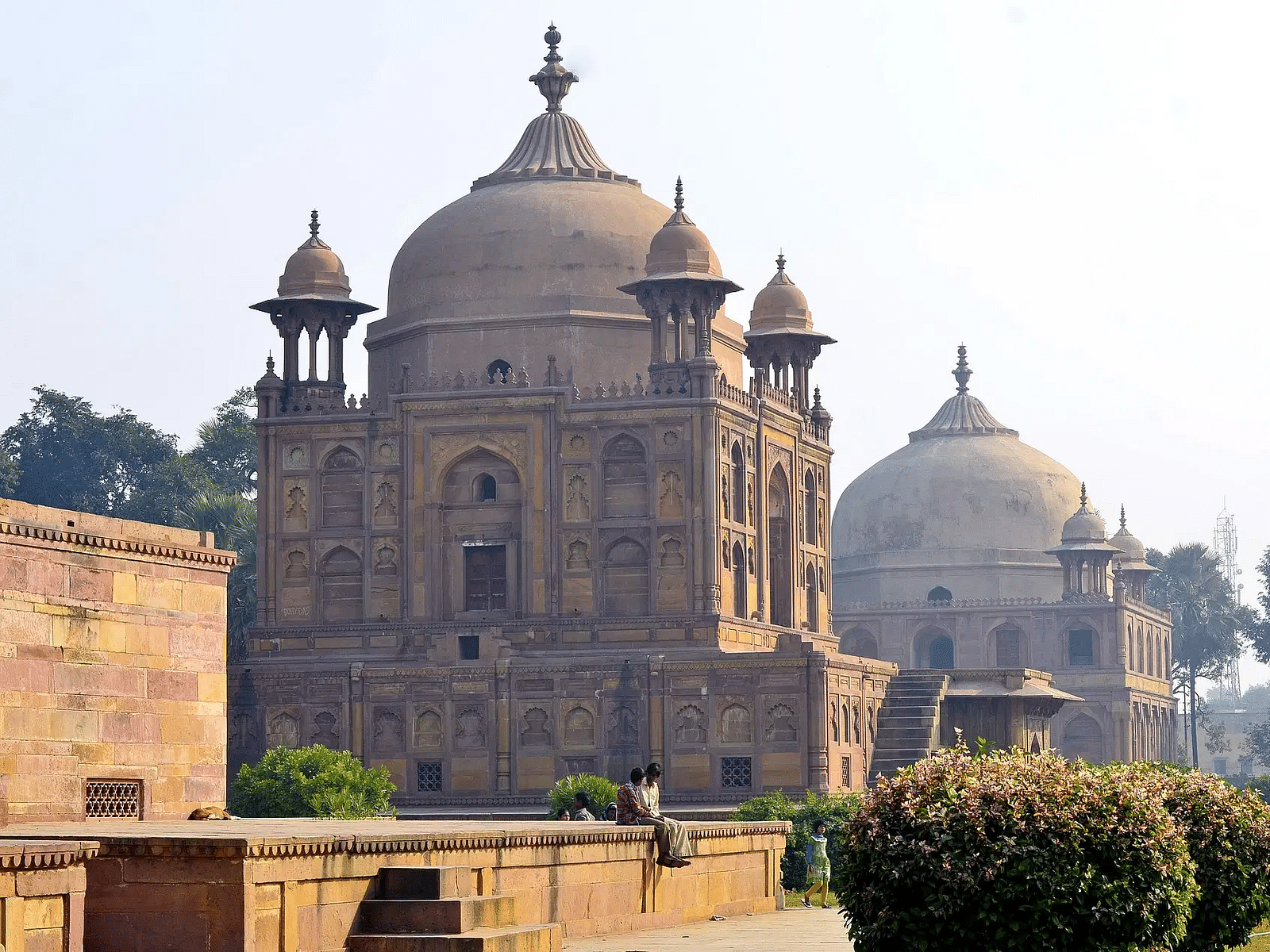 Historic mausoleum complex with domed architecture and garden.